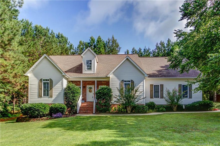 Lovely Ranch on 1 acre w/trees on 3 sides. 9' Ceilings, Vaulted family rm w/ French doors overlooking rear yard. Beautiful kitchen includes solid surface countertops, breakfast bar, & tons of cabinets. Hardwoods in all living areas except bonus. Walk in access to oversized attic. Plumbed for a 3rd bath with possible expansion. Split vanities in Master Bath w/large walk-in closet. Wooden shutters on most windows. Side load garage. Private rear year with an oversized deck & a fenced rear yard.