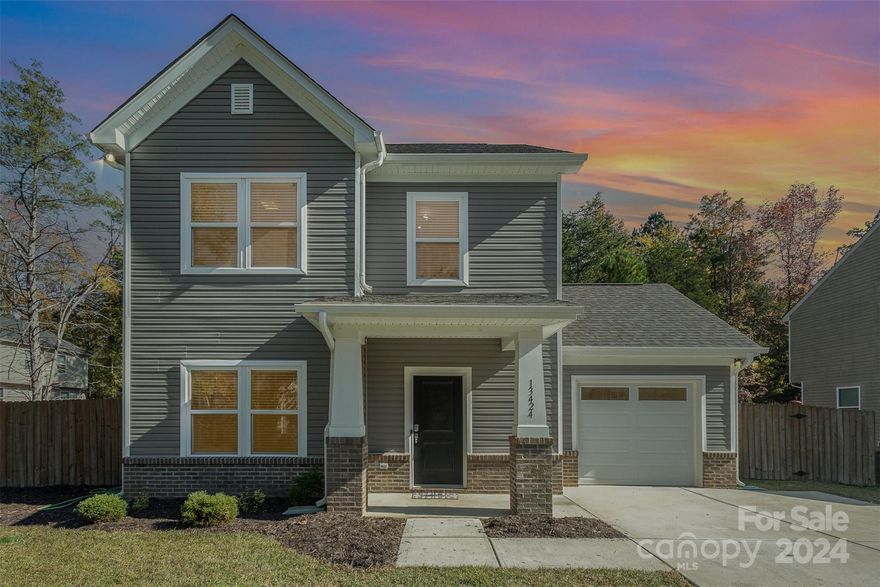 This remarkable three-bedroom, two-and-a-half-bath residence offers convenient access to Interstate 485 and Interstate 85, along with a variety of delightful dining and shopping options. For those who enjoy live music, PNC is just a short drive away, allowing you to attend concerts at your leisure. The downstairs area features an open floor plan, ideal for hosting gatherings and celebrations. Among its many appealing attributes are stainless steel appliances and a spacious kitchen island. The main floor also includes a generous laundry room and an abundance of natural light. The primary suite is designed with a walk-in closet, a double sink vanity, and a standalone shower. Additionally, the secondary bedrooms are roomy enough to accommodate visiting guests. The expansive, fenced backyard is perfect for relaxing after a long day. Welcome home!