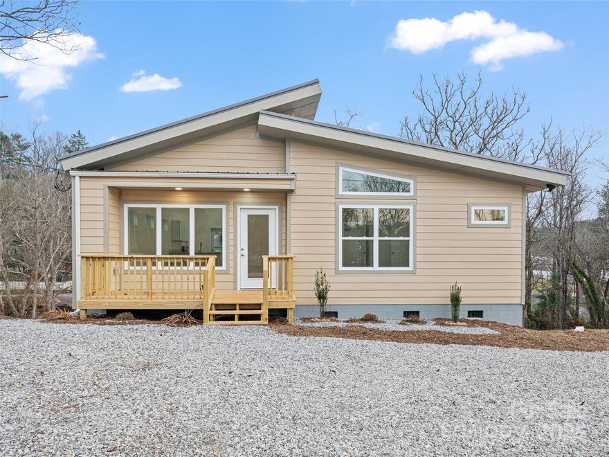 Brand-new construction in a prime Spruce Pine location—inside city limits and just minutes from downtown, shopping, dining, and all local amenities. This thoughtfully designed one-level home features a bright, open floorplan with luxury vinyl flooring throughout for easy maintenance and modern style. The spacious living area offers soaring ceilings and large windows that invite abundant natural light, creating a warm and welcoming atmosphere. The kitchen, dining, and living spaces flow seamlessly for everyday living or entertaining. Two comfortable bedrooms and two full bathrooms provide an ideal layout for full-time living, downsizing, or investment. With easy access, city conveniences, and quality new construction, this move-in-ready home is an exceptional opportunity in Spruce Pine.