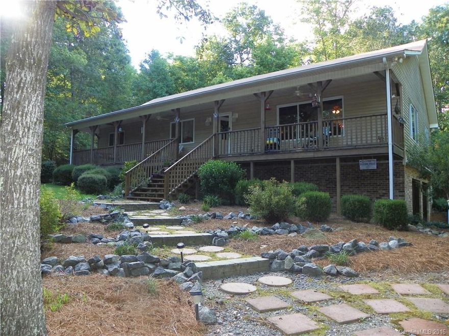 This 3 Bed and 2 Bath house sits on 6 acres.There is lots of privacy and low county taxes.  It features a beautiful rocking chair front porch, hardwoods in the kitchen and den and a gas fireplace. The garage is in the basement location and has lots of extra space. The home is nestled at the end of a cul de sac, includes in ground irrigation, a buried electrical line, and also has a Dry Pro vapor barrier in the crawl space. Carport, hot tub and a Snapper Mower are included in the purchase.