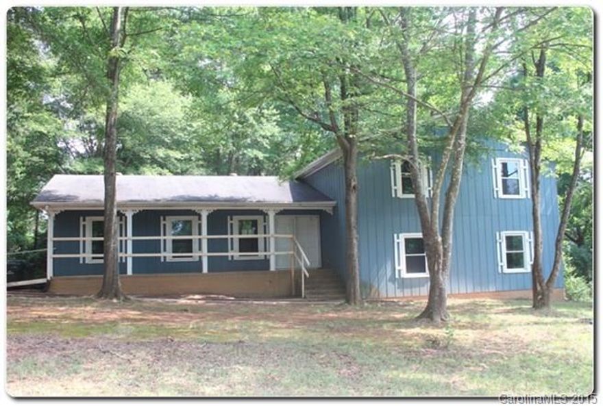 Charming home on large lot in Eastside Estates Subdivision! large home with covered front porch, elevated covered deck in back, In-ground pool and very private lot. Interior is in need of renovation but has tons of potential with the amount of space and bedrooms in home.