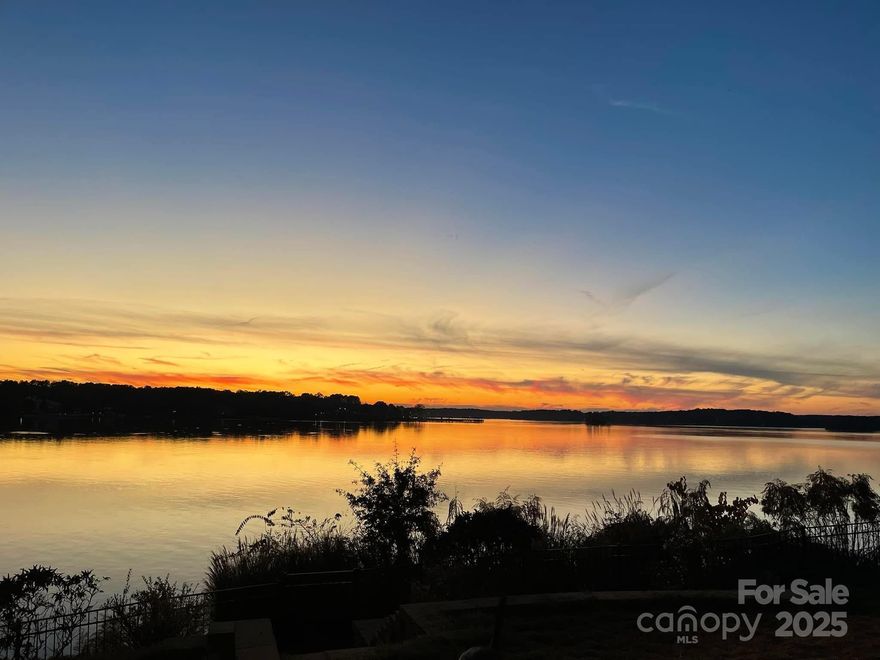 Lake Wylie. Main channel. Priced under appraisal. You don't usually get all three in the same sentence--or the same home. Throughout the home are large champion tilt in windows, a sunroom and a rebuilt deck that ensure the lake remains a focal point. The entire upper level is reserved for the primary suite—a sunlit sanctuary designed for rest.
The renovated lower level offers a main room, bedroom and full bathroom.It  walks out to the maintained salt water pool and a dock with two boat lifts. Outside, the yard is a quiet gardener’s paradise — tiered landscaping, four raised beds, pollinator and herb gardens, and deer fencing create a balance of beauty and purpose. Also has been recognized as a wildlife habitat! The shed is powered and insulated, and the brand-new luxury siding, gutters and metal roof offer peace of mind for years to come. Professional photos are on the way, but don’t wait for those. The lake doesn’t photograph what it feels like to stand still and take it all in.