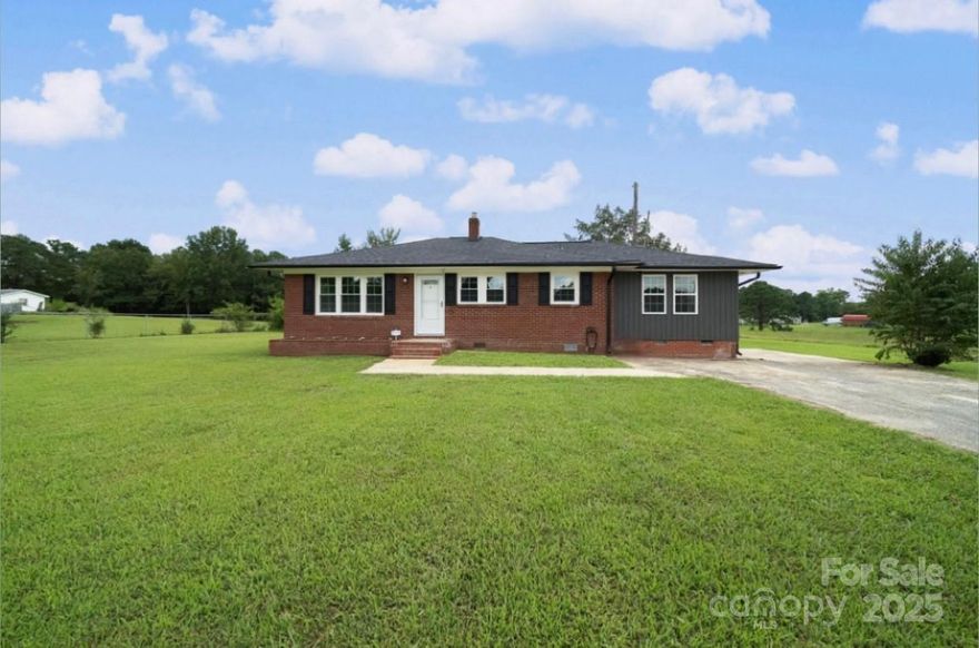 **Charming Fully Remodeled Ranch in Fort Lawn – Lewisville School District**

Welcome to **5154 Lancaster Highway**, a beautifully remodeled ranch-style home offering the perfect blend of comfort, modern updates, and small-town charm. Nestled on a generous **.78-acre lot**, this move-in ready property provides both privacy and convenience, making it an exceptional opportunity for first-time buyers, families, or anyone seeking the peace of country living while still being just minutes from major roadways and amenities.

This **3-bedroom, 1-bath home** boasts approximately **1194 square feet** of thoughtfully designed living space. From the moment you arrive, you’ll notice the inviting curb appeal and spacious yard that’s ideal for outdoor living, gardening, or simply relaxing in your own private retreat.

Step inside and be greeted by a **fully renovated interior** that feels fresh, bright, and welcoming. The home has been updated with **new windows throughout**, filling each room with an abundance of natural light. The interior showcases **new carpet** that creates a soft, comfortable feel underfoot, making the bedrooms and living areas cozy spaces for relaxation. The exterior has also some perks as well! New roof, new roof, new windows, new HVAC, and new hot water heater as well! 

The layout flows seamlessly, with a spacious family room at the heart of the home – perfect for entertaining or spending quality time with loved ones. The adjoining dining area and kitchen provide a practical and open space, featuring modern touches and plenty of cabinetry for storage. Whether you’re preparing weeknight dinners or hosting gatherings, this kitchen offers functionality with a clean, updated look.

Each of the **three bedrooms** is generously sized, offering flexibility for use as guest rooms, a home office, or playroom. The **remodeled bathroom** features tasteful finishes and a bright, fresh design.

One of the standout features of this property is the expansive **.78-acre lot**. With nearly an acre of land, there’s room for everything – from backyard barbecues and outdoor activities to potential future additions, a workshop, or even a garden oasis. The possibilities are endless for those who value space and freedom.

Beyond the home itself, the location is a true highlight. This property sits within the **highly desirable Lewisville School District**, known for its strong community values and excellent educational opportunities. You’ll also enjoy the small-town charm of Fort Lawn while being just a short drive from Chester, Lancaster, and Rock Hill. Major highways make commuting to Charlotte or Columbia convenient, offering the best of both quiet country living and city access.

With all the **major updates already completed**, including **new windows, new carpet, and a full remodel throughout**, 5154 Lancaster Highway is ready for its next owners to move in and make it their own. All that’s left to do is bring your personal touches and enjoy the comfort, style, and space this home has to offer.

If you’ve been searching for a property that offers the charm of a ranch home, the convenience of modern updates, and the space of nearly an acre lot – all in a fantastic school district – this is the one you’ve been waiting for.

Don’t miss the chance to make this beautifully updated ranch yours. Schedule your private showing today and see why **5154 Lancaster Highway** is the perfect place to call home.

This home has  been virtually staged to show what you could visualize the house looking like!