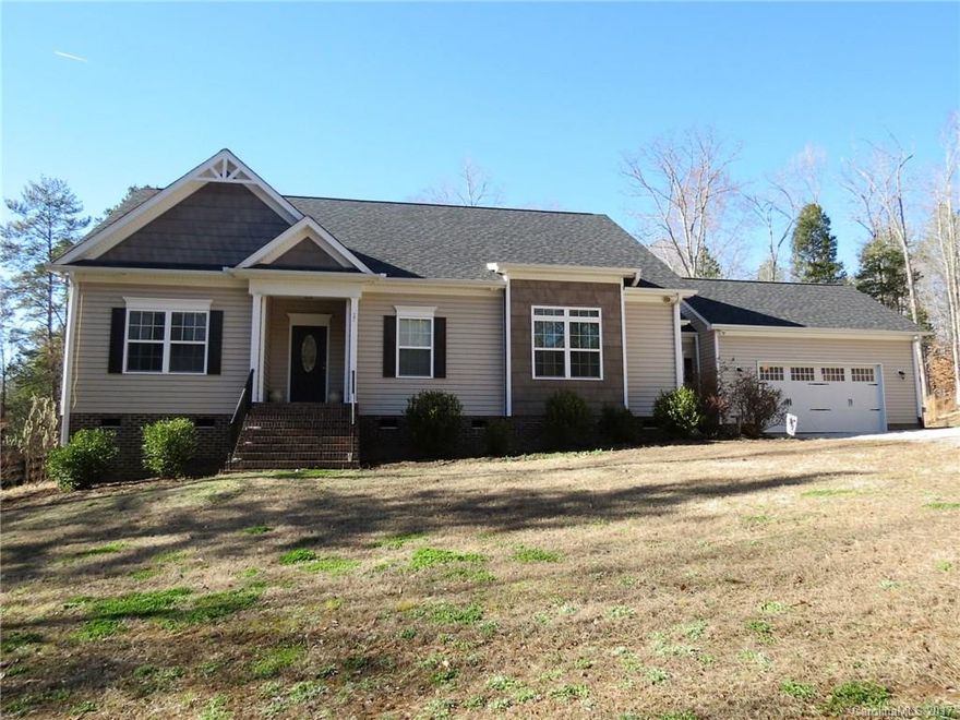 Beautiful home on 6+/- Acres in the Country.  This home has plenty of room inside and out.  The home has a large family room and open floor plan with a large kitchen.  The home has a split floor plan and large laundry room.  The home sits off the road and provides plenty of privacy.  The large back porch looks over the back yard and into the beautiful woods.  Great home for enjoying nature and the privacy of 6 acres.