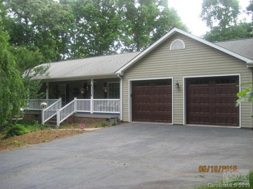 Move right in to this 4BR 2.5 bath ranch home with hardwood floors, updated kitchen featuring lots of cabinets, solid surface countertops, stainless steel appliances, under cabinet lighting, 3 BR main floor, large master bath, dbl sink,soaker tub plus seperate shower, dining room, large laundry off 2 car garage. Part of Bsmt finished w/family room, gas fp, half bath, balance of bsmt is heated but not finished. fenced back yard, large rear deck, covered front porch, tankless water heater, Note:doll case in bsmt to be removed. Large outbuilding nego. LR,DR,BR curtains do not stay. Home carries 1 year home warranty.