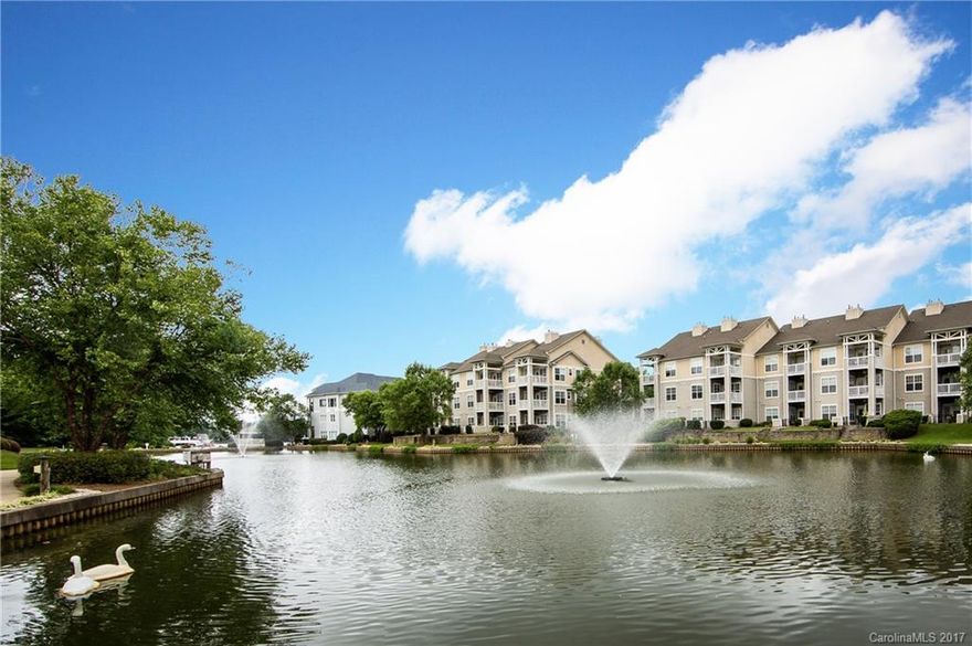 Motivated Sellers! All offers considered. Gorgeous, updated, water-view, end unit, 3bed/2bath on second fl w/ 9 ft ceilings, crown throughout. Lots of natural light. Both bathrms feature granite sinks & tile floors. Stainless appliances in kitchen, tile floors, granite counters & bar & tile back-splash. Bamboo flooring in dining. Fireplace, built-ins, & bamboo flooring in the family room.  Building has elevator, complex features pool, clubhouse, fitness & fitness center. Welcome to the lake!