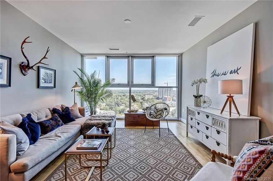 Luxury 1 bed 1 bath condo in high rise living with amazing view located in the Trademark building. Just a short stroll from Trade St, Knights stadium, Panther stadium, Romare Bearden Park, shops, bars & restaurants. Building has great security & deeded parking space within parking garage. Condo was just professionally painted & updated. Large amenity deck with cabana style pool located on 7th floor overlooking city including outdoor grill, pool table & fire pit. Don't miss the dog walk on P6.
