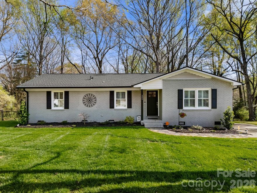 Fully renovated down to the studs, this one-level brick home blends modern updates with comfortable living, offering a space designed to be enjoyed both inside and out. Each room has been thoughtfully updated to create inviting areas for both everyday living and gathering with friends and family.

The kitchen serves as a central hub of the home, featuring white shaker cabinetry, black hardware, stainless appliances, floating shelves, tile backsplash, and quartz countertops—providing a functional and stylish space for preparing meals and hosting. The adjoining living and dining areas offer defined spaces that create a cozy setting for entertaining or relaxing.

The reconfigured primary suite provides a private retreat with a floor-to-ceiling tile shower, decorative accent, black hardware, glass shower door, and quartz vanity—designed with both function and comfort in mind.

Extensive updates from 2023 include plumbing (including fixtures), electrical (including panel), HVAC and all ductwork, insulation in the attic and crawl space, sheetrock, doors, flooring, light fixtures, and fresh paint throughout. All original paneling has been removed and replaced with sheetrock, and popcorn ceilings have been removed. A pantry and dedicated laundry area add to the home’s functionality.

Outdoor spaces offer additional opportunities to gather and unwind. The wraparound deck along the back and side entry provides a natural setting for entertaining, grilling, or enjoying quiet evenings. The fenced backyard offers space for pets, play, or outdoor activities, while the detached storage building adds convenience for hobbies or storage needs.

Recent exterior improvements include a new roof and gutters (2025). Plantation shutters throughout and updated flooring—including laminate in the main living areas and new carpet in the bedrooms—complete the interior.

Situated on approximately a half-acre lot with mature trees in a quiet neighborhood near downtown York with NO HOA. USDA 100% financing eligible. Schedule your showing to experience all this home has to offer.
