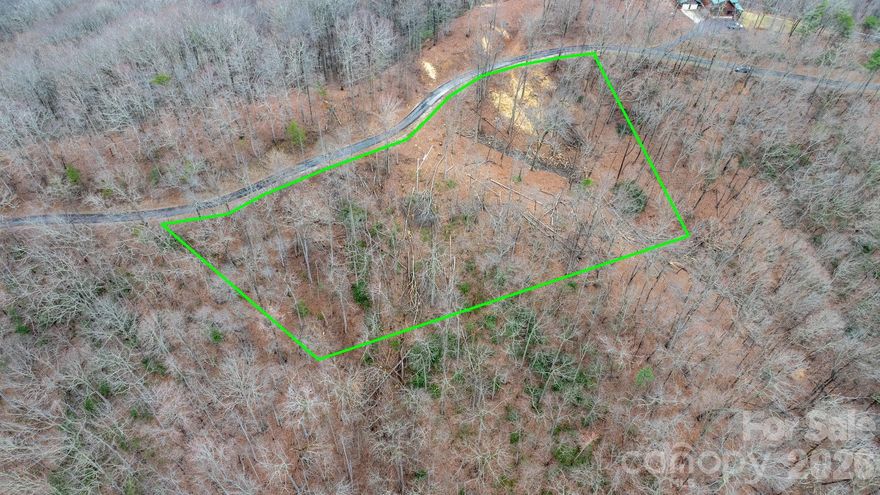 Welcome to Grants Mountain, where privacy, security, and natural beauty come together. This exceptional Lot #39 offers approximately 2.35 acres per McDowell County GIS — the perfect setting to build your dream home in the mountains.
Enjoy peaceful surroundings, mature trees, and plenty of space to create your ideal retreat while still being part of a well-maintained, gated community with 24/7 security. Whether you're looking for a full-time residence or a mountain getaway, this property provides the privacy and serenity you’ve been searching for. Both Lot 39 and Lot 40 are available for sale! Purchase one, or take advantage of the opportunity to own both for expanded views, added flexibility, and additional space.