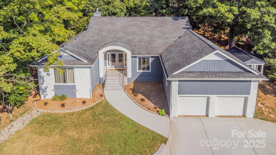 Welcome to this charming 3-bedroom, 2-bath home located in the highly desirable community of Tega Cay. The open floor plan boasts vaulted ceilings, wood flooring, and abundant natural light throughout.
The thoughtfully updated kitchen features butcher block and concrete countertops, a water pot filler, and stylish tile flooring. Gather around one of the home’s two wood-burning fireplaces, adding warmth and character to both living areas. The primary suite offers new lighting, direct access to the screened porch, and a private en suite with a soaking tub. The two additional bedrooms share a conveniently adjoining full bath.  Step outside to enjoy a spacious screened-in back porch and a large open patio—perfect for entertaining or relaxing on peaceful evenings. The front yard showcases a brand-new stone retaining wall with built-in night lighting, and the backyard extends beyond the rear fence for even more usable space.  Updated finishes throughout, Prime location near Lake Wylie, Carefree Boat Club, Marina, outdoor pool parks, walking trails, golf course, tennis, pickle ball, restaurants, shopping, and top-rated Fort Mill schools

Note: The shed on the side of the home does not convey and will be removed prior to closing.