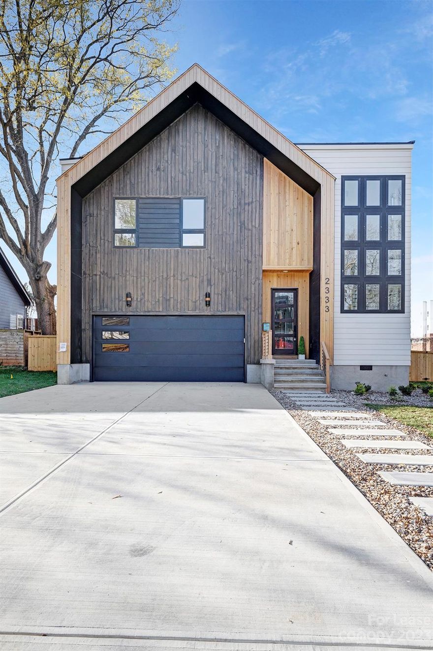 Come and make this fabulous, brand new construction 5 bed, 4.5 bath property your new home! Located in coveted Villa Heights/Plaza Midwood/Noda area, this modern, slick, split bedroom, open floor plan has everything you need.  With over 3400 sqft, the main floor has a spacious bedroom (possible office) w/full bath, open living room, dining, kitchen area with over-sized island for dining. The living room boasts of massive windows that overlook the well manicured, fully fenced-in back yard.  Upper level has 4 additional bedrooms and 3 full baths (one Jack/Jill style). Large walk-in closets compliment the upstairs bedrooms.  Laundry room is located on the 2nd floor for easy access with extra storage and utility sink for washing. Enormous master suite with huge walk-in closet with custom built in drawers/shelves put the icing on the cake for this property! And finally, if we could not get any better, the 2 car garage has a electric car charging station.  Unit is NOT FURNISHED