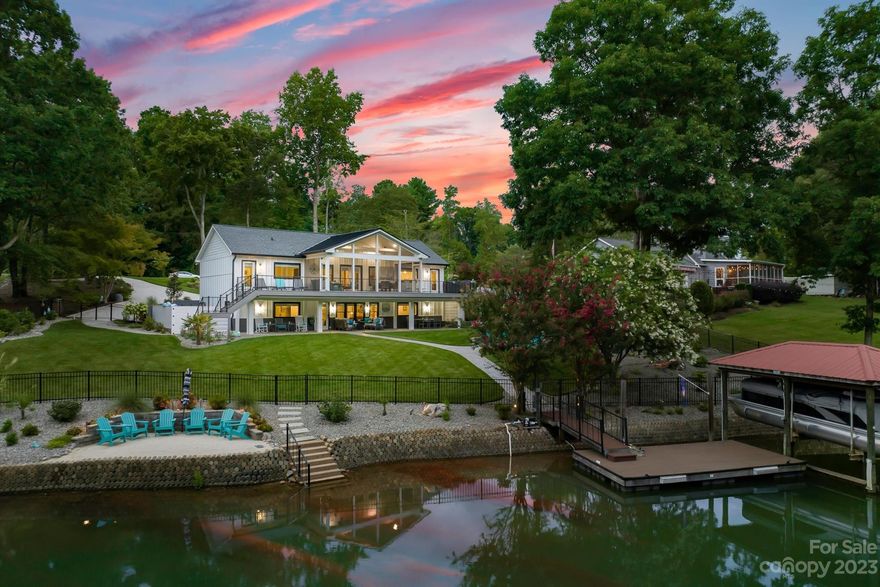 Exceptional two level waterfront home w/no HOA has been extensively updated. You will not be disappointed with this like new home! Easy year round waterfront living w/main level primary bedroom suite, spacious kitchen, and a cozy living room. On the main level you will also find a newly added screened-in porch with two flanking composite decks, providing the perfect space to enjoy the beautiful views of the lake while staying protected from the elements. Lower level offers 3 additional bedrooms, 2 full bathrooms, large recreation room and a flex room. The fenced yard provides privacy with a fire pit for gathering. Beach area and like new boat dock allow you to easily embark on boating adventures and explore Lake Norman at your leisure. Whether your are entertaining guests or simply relaxing with your loved ones, this lake home offers the ideal combination of comfort, convenience, and outdoor enjoyment. Great location only minutes to shopping, dining, parks & Charlotte airport-28 miles.