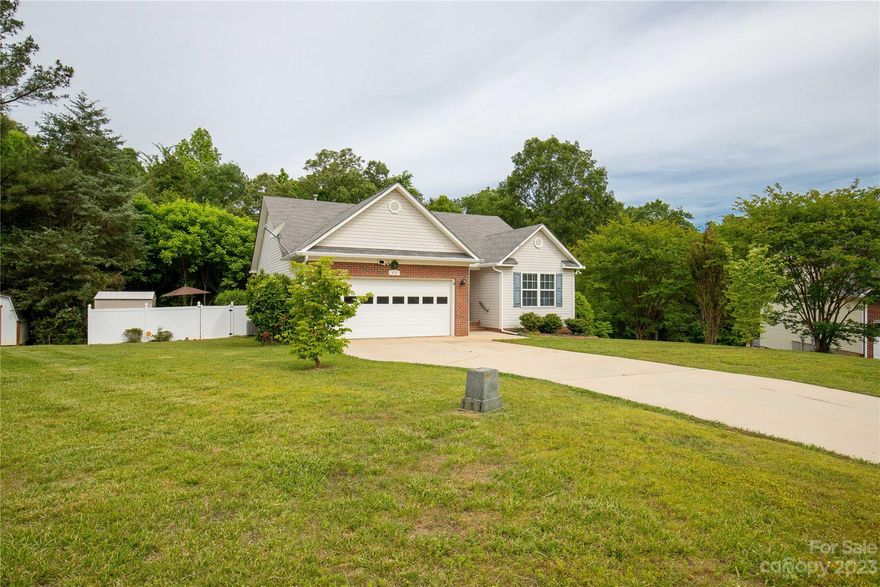 The perfect ranch, tucked in on one of the largest cul-de-sac lots in the community.  close to I-77 and Rock Hill Country Club.  Inside features a split bedroom floor plan with an open living area.  Living room includes a cozy gas log fireplace, vaulted ceilings, and an open window pass through to the kitchen.  Step outside to a fully fenced yard that is wooded for privacy or the opportunity to expand. A rear deck with natural gas connection for grilling and a lower patio are perfect for entertaining or relaxing.  This home is waiting for you.