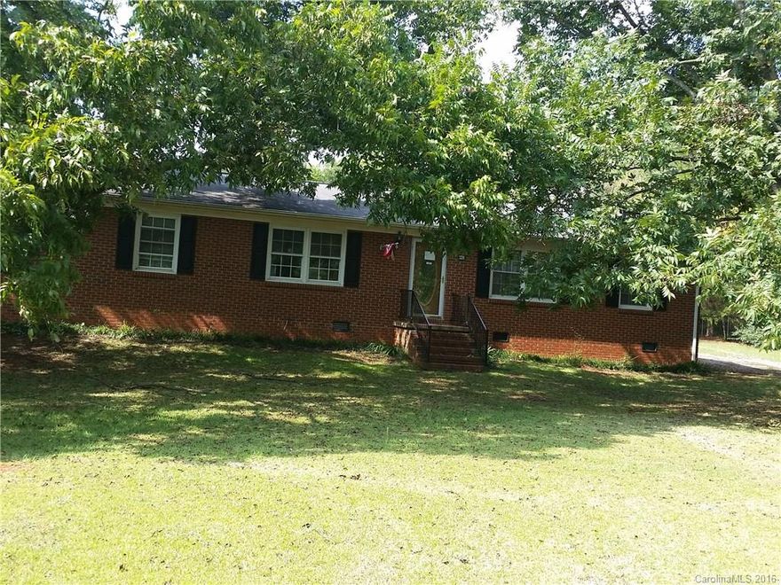 Great Location, Brick Ranch features 3 bedrooms, 2 full baths, Large Living/Dining Combo, Kitchen, Denwith Fireplace and Laundry, coverd Gazebow and patio with fish pond, large carport with 2 large storage buildings. 1.18 acre lot with huge pecan trees, beautiful setting very close to I77 and shopping. Outbuilding with rollup door is wired.