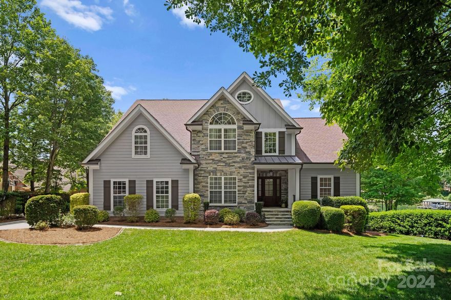 Welcome to your dream home on Lake Norman in the highly sought after Harbour at the Pointe. This beautifully renovated 4-bed,3.5-bath residence offers the lake lifestyle with exceptional community amenities including pool, tennis, pickleball, clubhouse, and boat launch. Enjoy an open two-story foyer and great room with floor to ceiling windows and a cozy wood/gas fireplace. Very comfortable and convenient floor plan with private office, laundry/mud room, and owner’s suite on the main level.  Discover a fully remodeled kitchen with custom white cabinets, quartz countertops, gas cooktop, and double oven. French doors lead you to the charming screened porch and multiple decks spaces. Updated bathrooms add a touch of modern luxury. The home boasts a 3rd-floor bonus room, perfect for an exercise room or theater. The outdoor space offers an expansive backyard with stone fire pit, Trex covered floating dock w/seating area, perfect for relaxing and taking in the lake views AND room for a pool.
