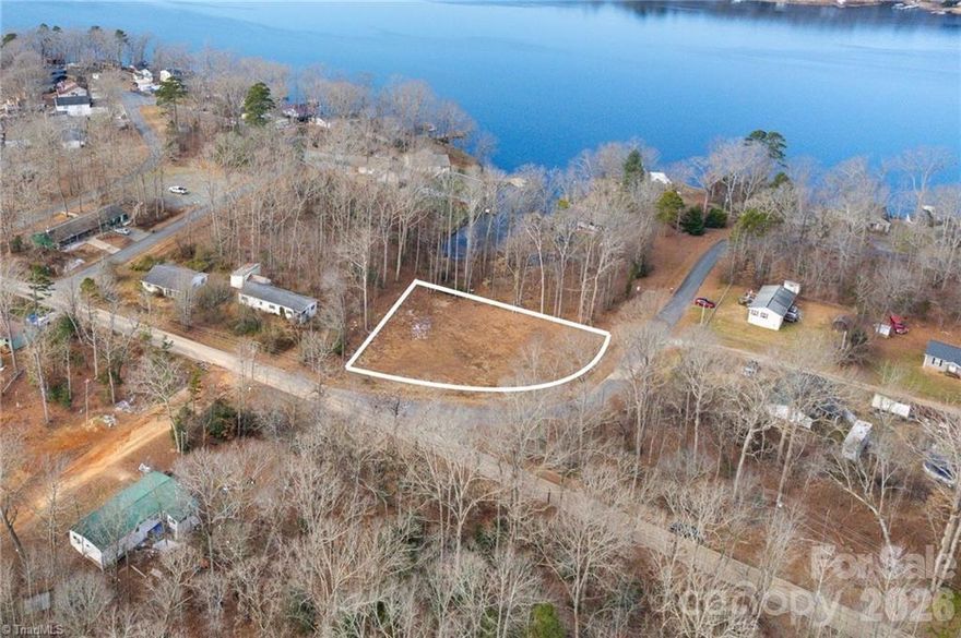 SELLER FINANCING AVAILABLE. Cleared lot near High Rock Lake offering partial lake views and a strong head start on your future build. A 3-bedroom septic permit (issued 2023, valid 5 years) is already in place, and house blueprints are available. Zoned RS—stick-built and modular homes only (no manufactured homes). Public water available through Davidson Water Inc. Great opportunity to streamline the building process and start sooner. Contact listing agent for details.
