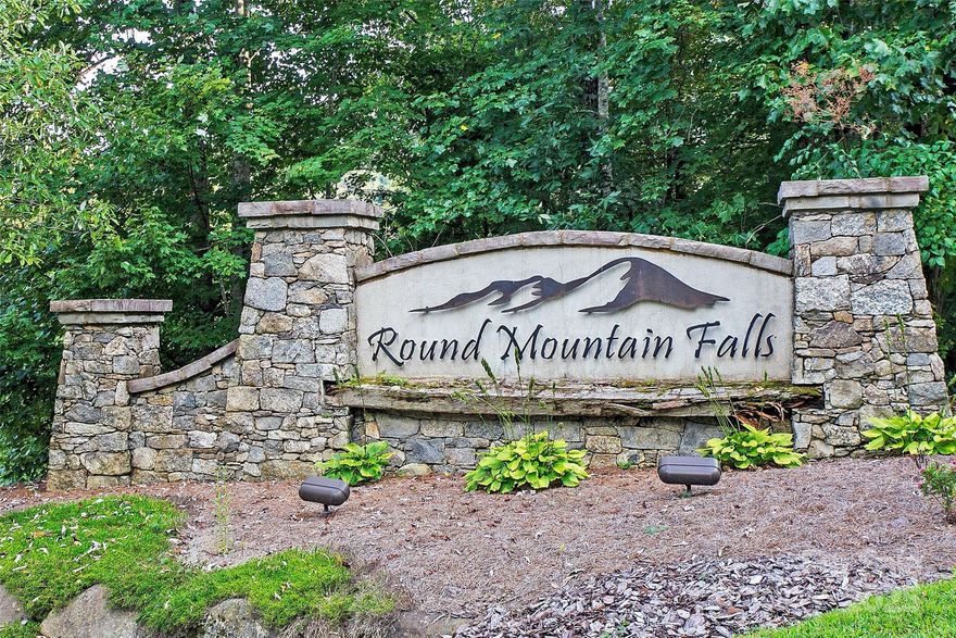 Large, private lot in the gated community of Round Mountain Falls.  Build your mountain home on this beautiful lot of approx. 3.27-acres near Brevard and Lake Toxaway.  Round Mountain Falls is a serene and beautiful community that features paved roads, gated entry, community pavilion, picnic tables, pond, walking/hiking trails and waterfall.