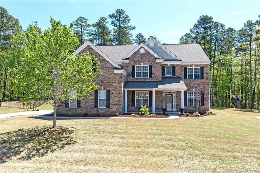 Gorgeous Haywood model in Wesley Oaks on cul de sac! Beautifully maintained 5 bedroom/4 FULL bath home with over 4,000 sf on private lot backing to common space!Master up plan with 3 additional bedrooms on second level plus Bonus Room.Bedroom/office on main with full bath. Big Kitchen w/walk-in-pantry, kitchen island & open to spacious Great Room. Freshly painted interior with neutral color. New carpet in downstairs guest bedroom. Meticulously maintained and move in ready! Feels like a new home!