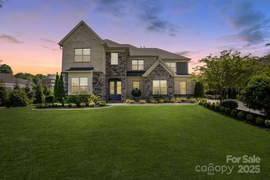 Set within a prestigious gated community, this remarkable 5-bedroom, 5.5-bathroom home offers a seamless blend of sophistication, comfort, and natural beauty. With serene pond views and timeless architectural detail, this home is designed to elevate everyday living while embracing effortless entertaining.
The open-concept thoughtfully designed kitchen flows gracefully into a light-filled morning room and keeping room area, creating a warm yet refined atmosphere. Highlights include a butler’s pantry, custom wine storage room, formal living and dining spaces, and en-suite bathrooms in every bedroom. A dedicated command center, bonus room, private office, and three-car garage provide versatility and convenience, all complemented by abundant storage throughout.
Step outside to your own resort-style retreat, complete with a covered porch, pergola lounge, and lushly landscaped gardens nourished by a private well—all overlooking tranquil pond views.