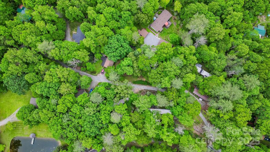 Investment Opportunity – Hendersonville, NC Mobile Home Park
Rare 6.34± acre investment between Flat Rock and Etowah. Located at 140 Old CCC Rd, this park features 10 seller-owned mobile homes (7 single-wides, 3 double-wides), each with its own septic system. Water is provided by two shared wells for low utility costs. Two cleared pads offer space for new mobile or tiny homes. A garage with electric and plumbing could be converted to another income-producing unit. Strong current income with room to grow. Financials available upon request. Turn key investment with immediate cash flow and long-term potential. Minutes from Hendersonville’s vibrant downtown, outdoor activities, and local amenities. Offered as-is. Contact listing agent for full details and to schedule a private tour.