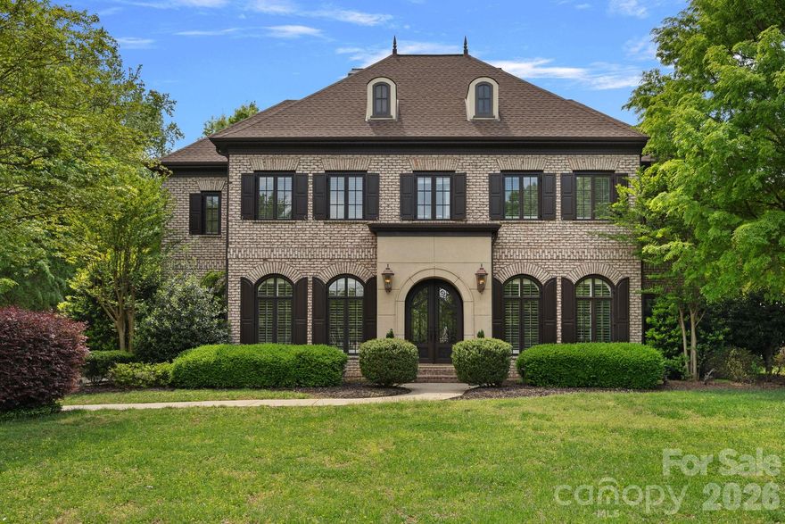 All-brick custom residence set on a beautifully flat 1.48-acre homesite, this Simonini-built custom home offers privacy, craftsmanship, and enduring appeal.

The four-bedroom, four-and-a-half-bath floor plan is defined by coffered and tray ceilings, refined architectural detailing, and expansive windows that flood the interiors with natural light. An open, airy layout provides effortless flow for both everyday living and entertaining.

Outdoor living is seamlessly integrated with a screened rear patio overlooking the pool and fully fenced backyard, offering privacy, functionality, and space to enjoy the expansive lawn. A three-car garage with its own dedicated heating and cooling system adds versatility and comfort. Major updates include upper and lower HVAC systems replaced in 2022 and a new roof in 2022.

Completing this exceptional offering is a motivated seller and dedicated boat slip (Pier Z #46), providing convenient access to Lake Norman and the coveted lake lifestyle