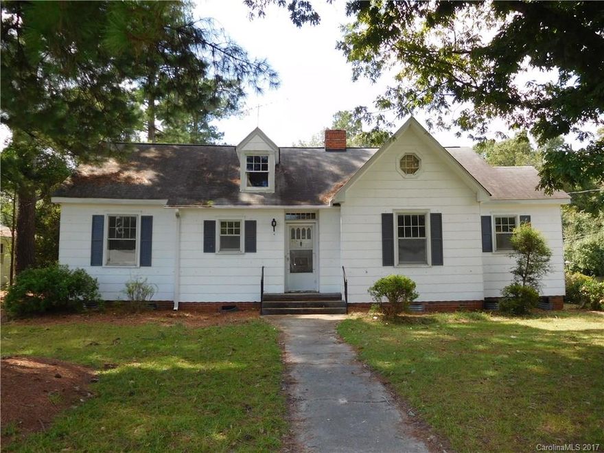 Great move-in ready home with loads of character. Hard-to-find attached 2nd living/studio/in-law suite with kitchen and separate entrance. Main portion of the house has 3 bedrooms and a full bath. All rooms feature crown molding, solid wood doors, glass knobs, and 3rd bedroom could be an office as it features a wood burning fireplace. French doors lead to formal dining room. Two screened porches. Very large storage building (15'x12'). Convenient location near downtown and the public library.