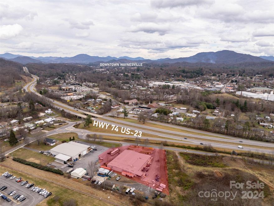 This highly visible commercial property in beautiful Waynesville, NC, offers a fantastic opportunity with over 14,000+ square feet on slab retail sales space, offices, storage and a warehouse/shop conveniently located just off Hwy 23/74 w/170+- feet of road frontage & 30 parking spaces. The property is designed to accommodate a variety of business needs, featuring dedicated sales offices, five restrooms, and impressive ceiling heights ranging from 11'6" to 18'. Additional features include three-phase power and access to city water and sewer services, making it an ideal location for a thriving business in a prime location.
