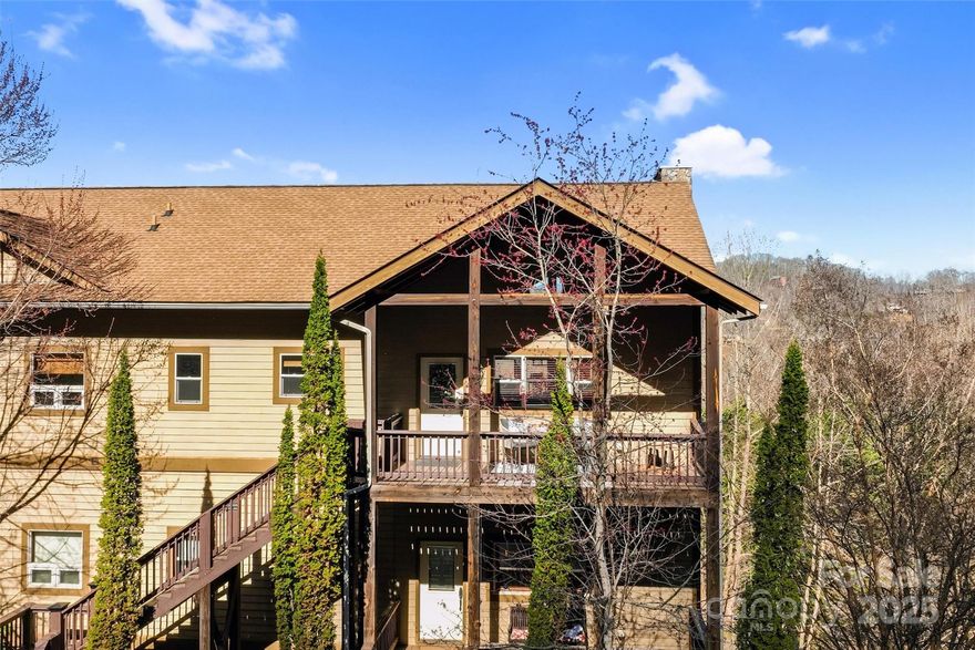 Enjoy the beautiful mountain views from this lovely 2-bedroom, 2-bathroom condo featuring elegant cherry wood floors and soaring  tongue and groove wood 12-foot cathedral ceilings. The open-concept living and dining area is perfect for entertaining, with large windows that fill the space with natural light. The modern kitchen boasts stainless steel appliances, granite countertops, and ample cabinet space. The spacious primary suite is a true retreat, offering breathtaking eastern mountain views, a generous walk-in closet, and a luxurious en-suite bath with dual sinks, a soaking tub, and a separate shower. A second well-appointed bedroom and full bath provide comfort for guests or a home office. Enjoy the convenience of in-unit laundry, rese detached single car garage, and access to community amenities. Conveniently located a 15 minute drive to Bryson City and Cherokee, this exceptional condo offers the perfect blend of elegance and convenience.