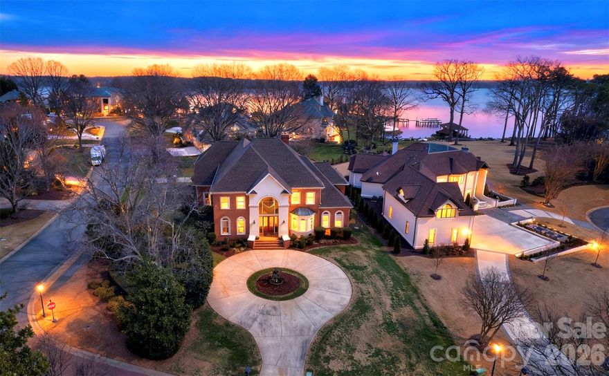 A rare opportunity in the highly sought-after Peninsula community! This stately three-story brick home showcases beautiful water views and offers over 5,500 square feet of elegant living space. Custom-built and impeccably maintained by its original owner, the home features 4 spacious en-suite bedrooms, a massive entertainment/bonus room, plus an additional oversized bedroom/bonus space, and a bright, open floor plan designed for both everyday living and entertaining. The gourmet kitchen is a true centerpiece, complemented by fresh interior paint throughout, giving the home a crisp, move-in-ready feel. An extra-large 1,080 SF 3-car garage with additional storage adds exceptional functionality. Perfectly located just minutes from shopping, dining, and entertainment, with top-rated schools and quick access to I-77, this home delivers privacy, prestige, and convenience. Homes of this caliber in the Peninsula rarely come to market