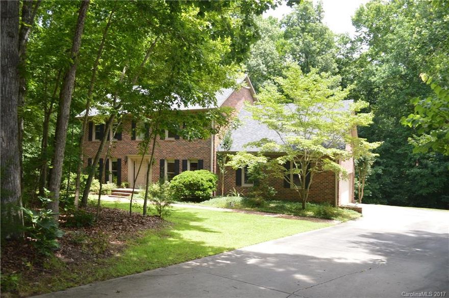 Almost 3.5 Acres on a beautiful wooded lot w/a private setting in established neighborhood! Custom built- 3Br 2.5Ba w/bonus room & office could be 4th Br. Kitchen- recent updates offering custom cabinets, pantry, granite tops, granite back splash & stainless appl. Breakfast, Formal Dining & Living room. Sep Den w/brick wood burning F/P. Large master w/walk in closet Garden tub & sep shower, Updated light fixtures through out, 2 HVAC units, Roof 4yrs. City water/sewer avail. Northwest Schools!