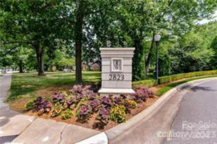 Rosewood is the Place to Be!  Fifth Floor condo with Panoramic view of Charlotte skyline and overlooks the pool and beautifully maintained landscaping around Rosewood.   Distinctive curved windows in Living room adds  architectural interest  along with extensive millwork throughout the home. 10 foot ceilings and Hardwood floors throughout the home. Luxurious tile and granite in bathroom. Split bedroom plan with an additional space ideal for office or library. Closets with built-ins offer plenty of storage.  Enjoy beautiful sunsets from covered patio.  Note this is an end unit.