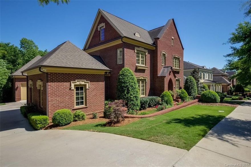 This large all brick Simonini gated Heydon Hall residence shows like new! Enjoy stunning architectural features including a dramatic spiral staircase and open main floor plan with chef's kitchen that leads to deck and overlooks gorgeous fenced, private, landscaped yard. It has a large master suite on main, four beds upstairs and a bonus room. The basement has a gym, bedroom, bar and wonderful entertaining space that opens up to the yard level. This home also has a three-car garage.