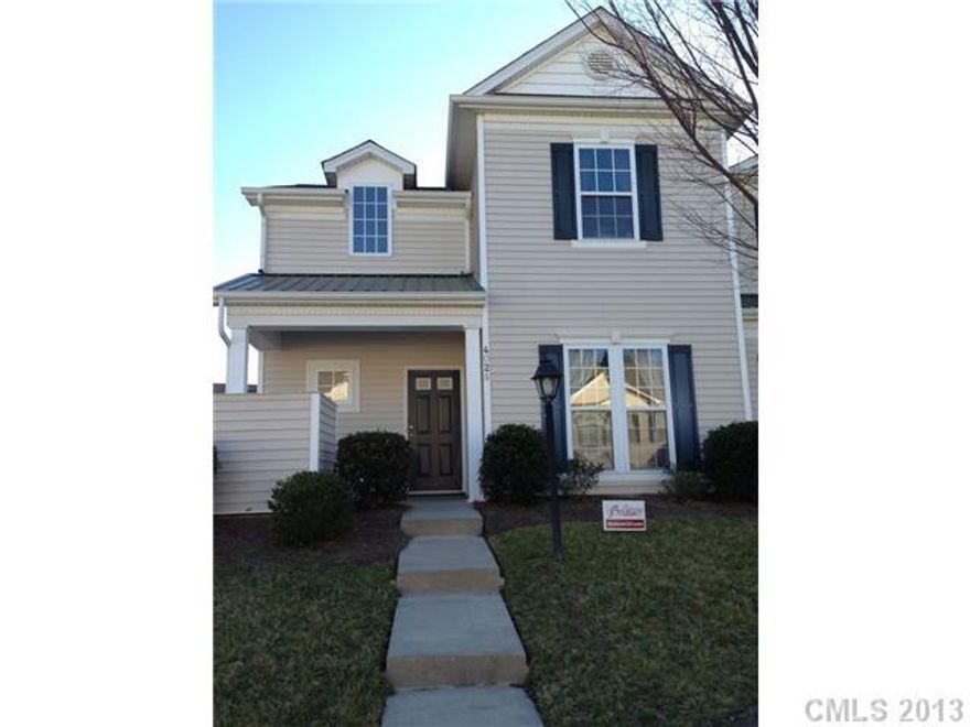 Beautiful end-unit in Harrisburg Town Center. Close to Charlotte/Concord/UNCC! Great community! Walking distance to restaurants, grocery stores, & more! Laminate wood floors in Great Room & Kitchen. Brand NEW carpet throughout! Master bedroom downstairs with HUGE walk in closet with garden tub in master bath. Two bedrooms upstairs + loft! Custom lighting throughout, plus ceiling fan in each room!