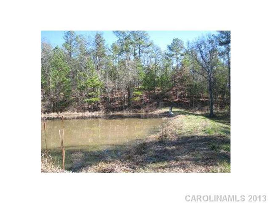 Small Pond for ducks, fishing and wildlife in center of land.  Private campsite with electricity. Rolling terrain with year round stream, trails, foodplots with nice box stands.  Nice section of hardwoods along stream and around pond.  Property has long paved frontage and joins large parcels of US Forest Service.  65 Acres of timber has been sold and will be harvested in 2015.  Land has abundant wildlife.