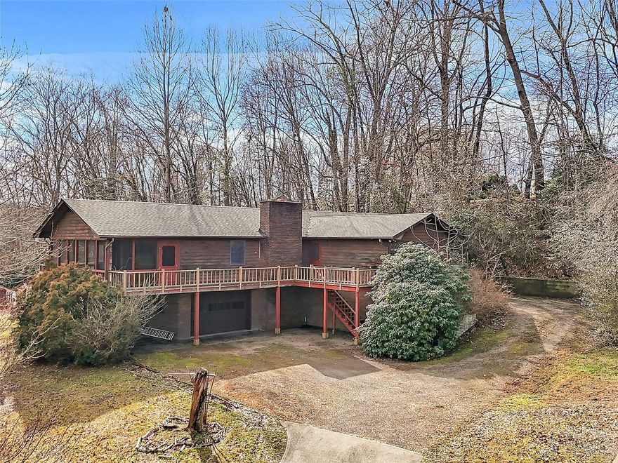 Charming Rustic Home PRICED BELOW TAX VALUE: Welcome to this unique rustic retreat just minutes from downtown Franklin. This 1761 sq ft home offers a rare opportunity for those seeking a property with character and room for personalization. Boasting 2BR, 2BAs and a spacious open living and dining area with vaulted ceiling, this home provides a cozy and inviting atmosphere. The highlight of the living rm is the lg wood burning stone fireplace, perfect for creating warm and memorable gatherings during colder months. In addition to the main living space, the property features a 402 sq ft storage area, ideal for storing outdoor equipment or converting into a workshop. Enjoy the outdoors from the comfort of the large screen enclosed front porch. 
While the home is in need of updating and maintenance, it presents a wonderful opportunity to create a personalized and charming living space. Embrace the potential of this property and explore the possibilities that this rustic gem has to offer!