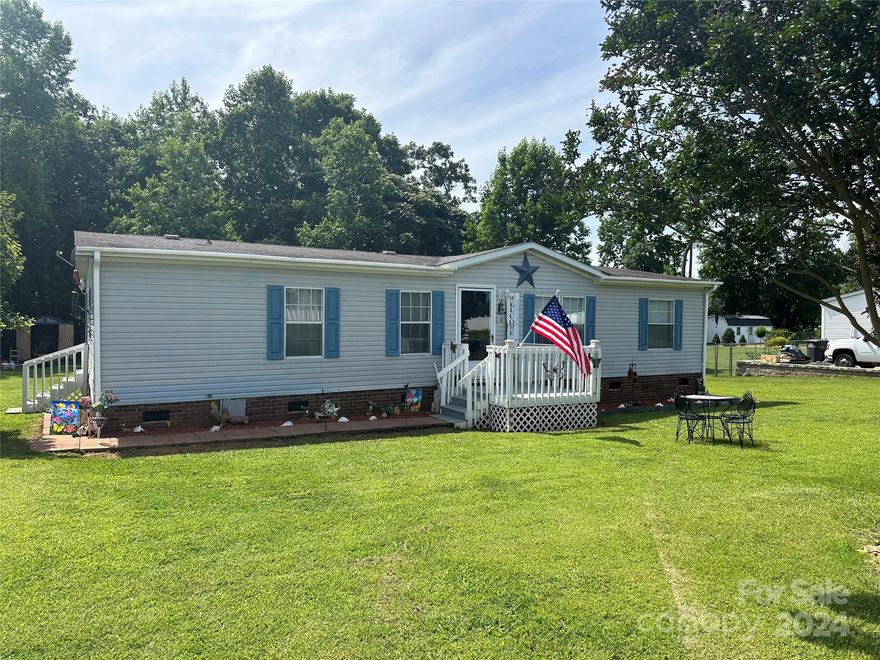 Nestled on .46 acres with 3 Bedrooms & 2 Bathrooms split floorplan located on a .46 acre lot. Located 6 miles from I-77 at exit 42.  Recent updates: Vinyl plank flooring (2023)  installed in the Living Room, Dining Room & Hallway,  and Electric Stove (2023). Open Kitchen with eat-in bar. Separate laundry room. The primary bedroom has a walk-in closet, garden tub & separate shower. Storage Shed, playset, washer, dryer, and refrigerator will convey. Sold as is.