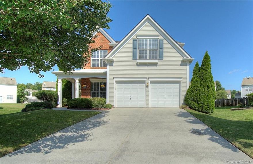 Looking for a community within walking distance to a grocery store, retail and restaurants? Look no further. This home is move-in ready and in excellent condition.  Rocking chair front porch.  2 story foyer.  Large eat-in-kitchen with an island. Master suite with sep tub and shower. Roof (2017) HVAC (2013) Whole house filtration system. Refrigerator, washer and dryer included. 1 year home warranty. Quick access to 85, 485, UNCC, University Research Park and Concord Mills. Swim, tennis community.