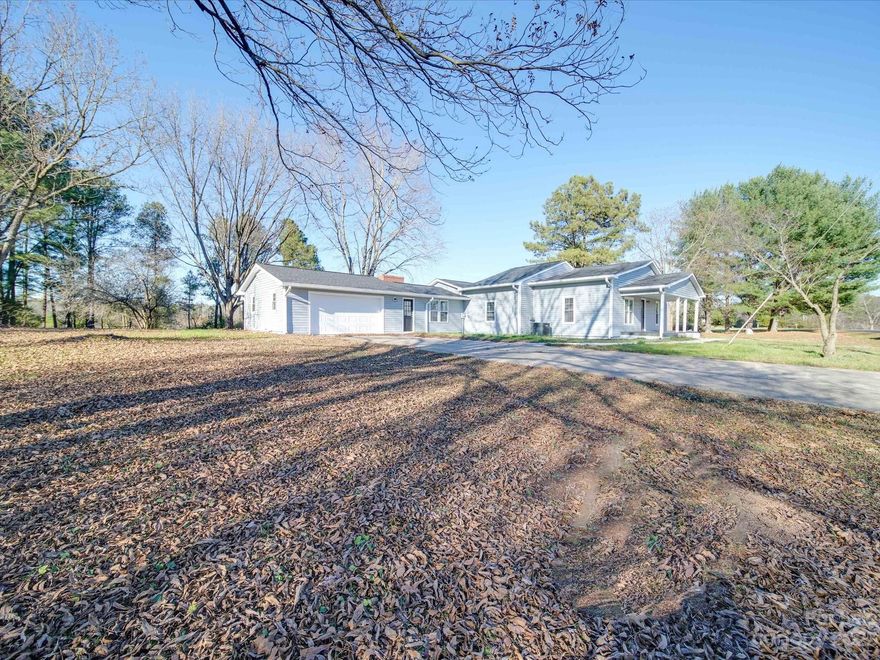 PRICE IMPROVEMENT!! A FANTASTIC VALUE!! | WELCOME TO YOUR DREAM COUNTRY RETREAT! This beautifully improved farmhouse, nestled on expansive acreage with serene pond offers the perfect blend of classic charm & modern luxury! Situated in a peaceful setting, this property is a nature lover's paradise! So many beautiful improvements!  Lets start with the Kitchen which offers an abundance of cabinets, center island, granite & stainless appliances with spacious dining area which connects to the large new back deck for easy entertaining! Formal Living Room & Family Rooms areas, Primary Bedroom with Luxury En Suite Bath. Check out all the gorgeous tile in both baths! New Roof & New HVAC! This is your opportunity to embrace a tranquil way of life while enjoying all the comforts of modern living! Don't miss this unique opportunity to call this breathtaking property your forever home!