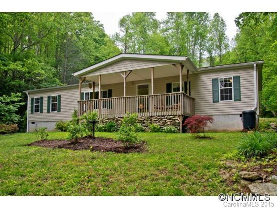 Private, peaceful, and move in ready! Upgrades include bamboo floors in family room, tile floors in bathrooms, crown molding, oak cabinets and tile counter tops. Back deck, covered front porch, 12 x 10 storage shed, and animal pen. Split bedroom plan, open kitchen/dining, natural landscaping and fresh paint. 4 bedrooms but septic approval for 3. Garden area behind home. Quiet setting suitable for a permanent or vacation home in the mountains!