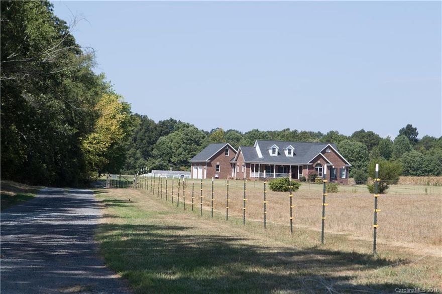 Lovely Country Property, Nearly all 12 acres is pasture, some fenced,   Covered porches, front & rear, Additional 374 sq ft is bonus room over the garage,  garage is not attached but access is off covered rear porch, Oversized eat in Kitchen with Island, wall oven, built in microwave,  gas cook top and access to covered porch,  Large Great Room, Beautiful Fireplace with blower,  built in rear speakers for surround sound & also features access to the rear covered porch.  Sale includes 2 parcels.