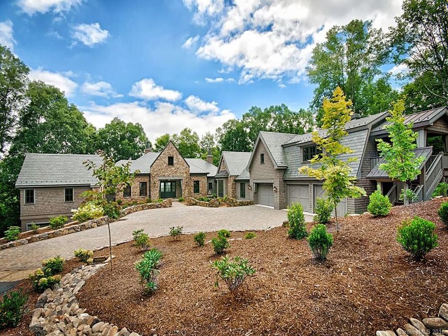 Take a ride on the wild side through an 1,800 acre gated conservancy to luxury, privacy and incredible views. Contemplate tranquility or rock out to your heart and soul's content. An easy 40 minute drive to Asheville and   phenomenal hiking, biking, stargazing and more. Three gorgeous en-suite guest and living quarters plus another for staff.  Opulent yet elegant and refined, built for close  to $4,500,000, with minimal real estate taxes of less than $7,000 per year.