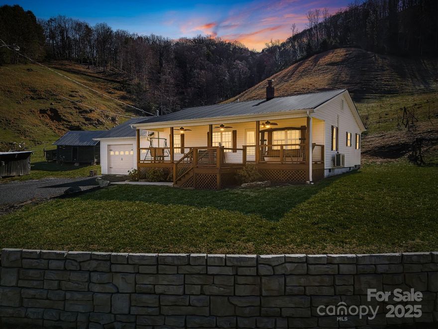 SELLER OFFERING OWNER FINANCING! REDUCED TO SELL! Welcome to 867 Indian Creek Rd—your mountain dream retreat nestled in the heart of Burnsville, NC. Set on 63 acres of unrestricted land, this one-of-a-kind property offers endless possibilities. From homesteading to multigenerational living or simply enjoying peace and privacy of wide-open space, this is a rare find. The beautifully completely updated farmhouse features 2 cozy bedrooms, 1 full bath, and timeless charm throughout. Step outside to discover a spring house, a large barn perfect for animals or storage, and a soothing creek that runs through the land. Located a short drive to downtown Burnsville, Asheville, NC, and Johnson City, TN. Whether you’re seeking serenity or a place to build your vision, this property is ready to welcome you home. Don’t miss out—schedule your private tour today and experience the magic of Indian Creek for yourself.