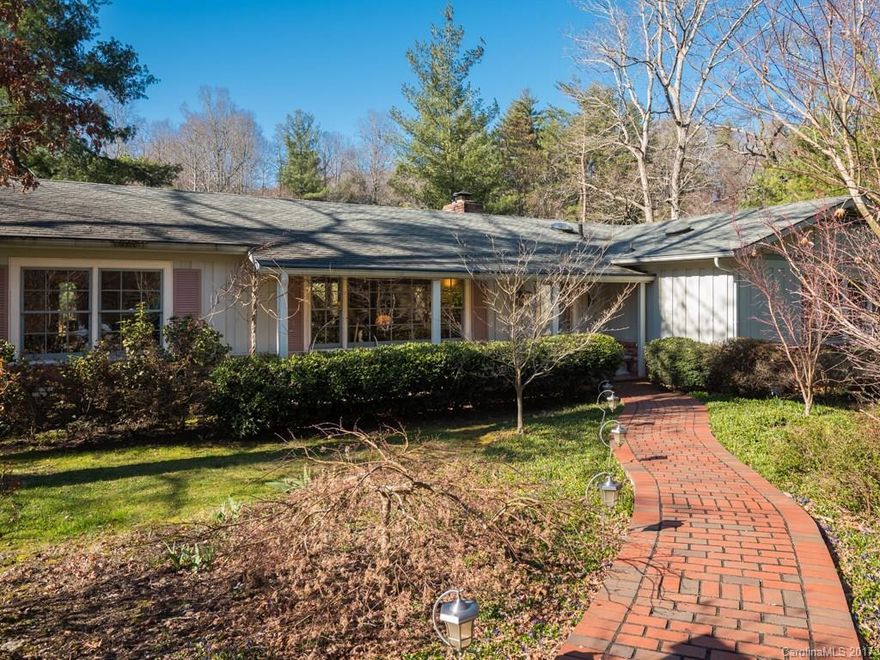 Updated and elegant, this home is one of 6 homes situated on a lake.  Wonderful deck with outdoor kitchen is perfect for  entertaining and enjoying the lake view.  Decking leads to the lake with dock and seating area.  Updated kitchen with stainless steal appliances.  The inviting  sun room is washed with natural light.TV over F/P does not convey