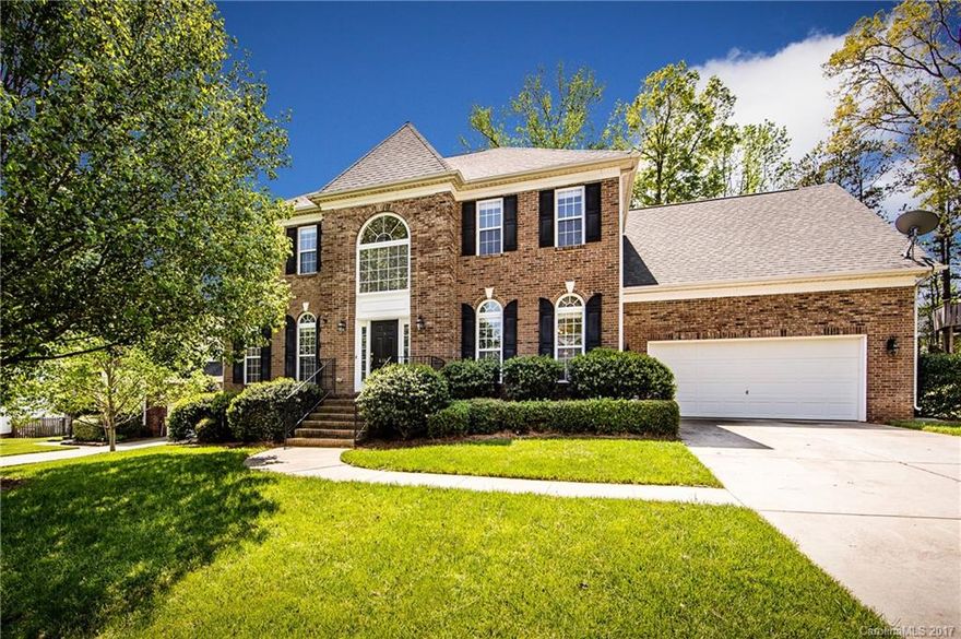 STUNNING BRICK FRONT HOME w/open floor plan, fenced yard & deck, extended garage, huge laundry/mud room & super walk-in pantry! 2 story Great Room & Foyer, crown molding in formals & wainscoting in the DR & Foyer too! Home has 2 inch blinds, gas log fireplace in GR, walk-in attic space & granite counters, ss appliances, ss sink w/upgraded faucet & breakfast bar in cook's kitchen.  Master w/tray ceiling, ceiling fan, dual vanities and great closet.  Bedroom on main w/full bath too! Roof - 2011!