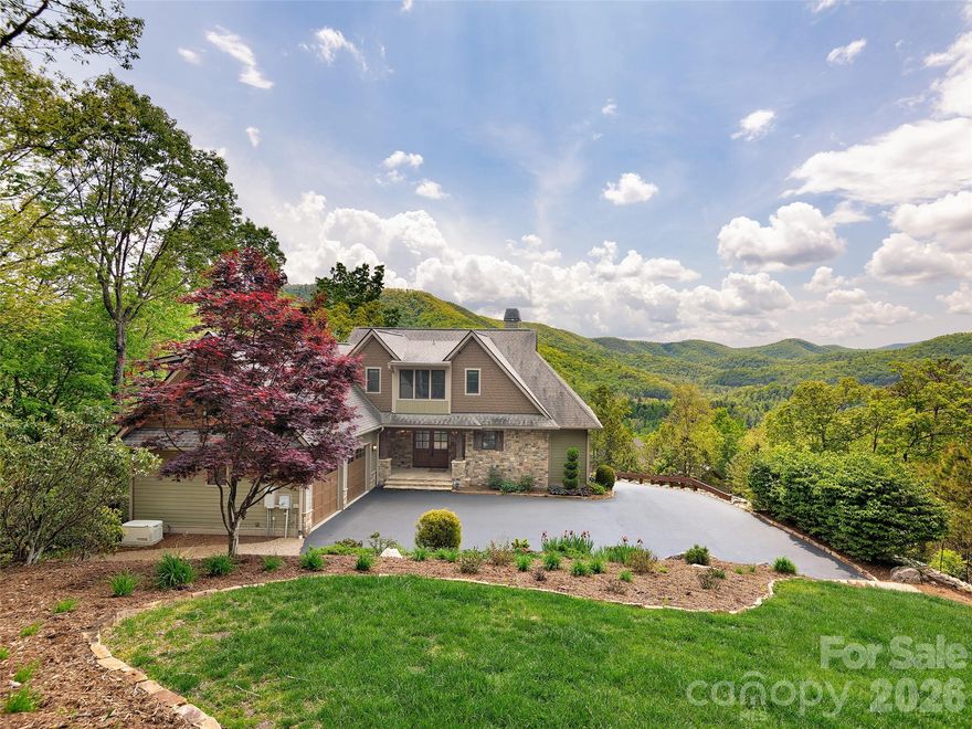 Experience refined mountain living in this stunning 4-bedroom, 4.5-bath estate nestled on 1.78 private acres in an exclusive gated community. With 4,100 square feet of thoughtfully designed space, this home offers the perfect blend of luxury, comfort, and natural beauty. Step into a sun-drenched, southern-facing great room featuring a striking fireplace and jaw-dropping mountain views. The chef’s kitchen is a dream come true—complete with a gas cooktop, double oven, ample counter space, and beautiful cabinet, all flowing seamlessly into open-concept living and dining areas with rich wood flooring throughout. Enjoy peaceful mornings on the screened porch, quiet evenings on the expansive back deck, or gather around the custom fire pit under the stars. Professionally landscaped grounds provide year-round beauty and privacy.