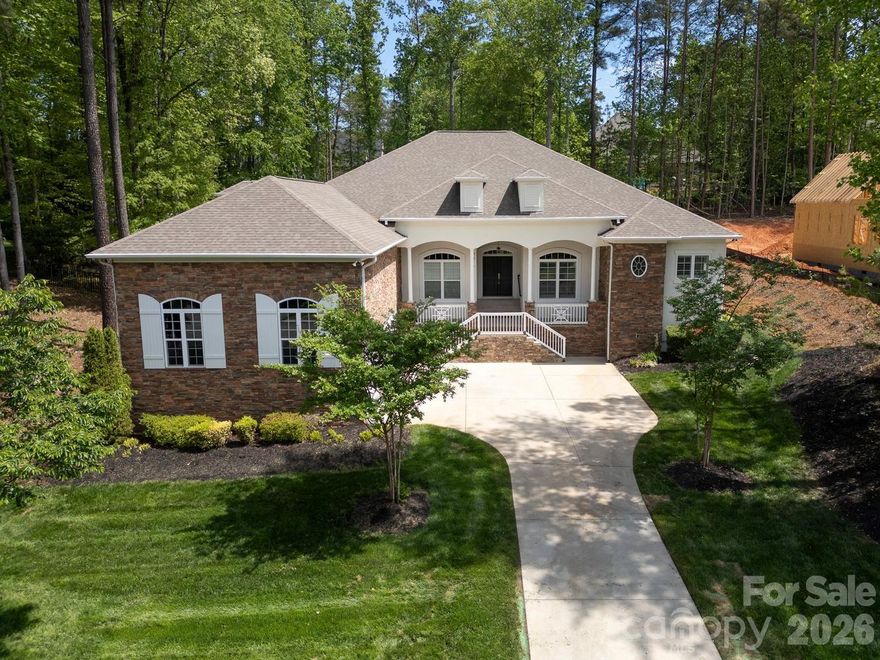 Exceptional custom-built one-story home blending luxury, comfort, and cutting-edge technology. Open floor plan showcases rich hardwood flooring, custom archways, and tray ceilings throughout main living areas. Formal living room features a stacked stone gas log fireplace, built-ins, and a striking 500-gallon mixed reef aquarium. Elegant dining room with picture frame molding is ideal for entertaining.
Gourmet kitchen designed for the discerning chef with double ovens, gas range, granite countertops, tile backsplash, stainless appliances, and a large center island with prep sink—all open to the great room. Private primary suite offers a spa-like bath with dual vanities, makeup area, garden tub, and tiled shower. Split-bedroom layout includes three additional bedrooms, one with ensuite bath perfect for guests or multi-generational living.
Outdoor living shines with an expansive deck, outdoor kitchen, and gas fire pit—perfect for relaxing or entertaining. Oversized 3-car garage with 20-ft ceilings, a 50 amp EV charger and a 10K lb lift  ideal for car enthusiasts. Smart home system and whole-home automatic generator provide modern convenience and peace of mind. Located in a desirable community with gated boat storage and easy access to a public boat launch at Little Creek .2 miles away.