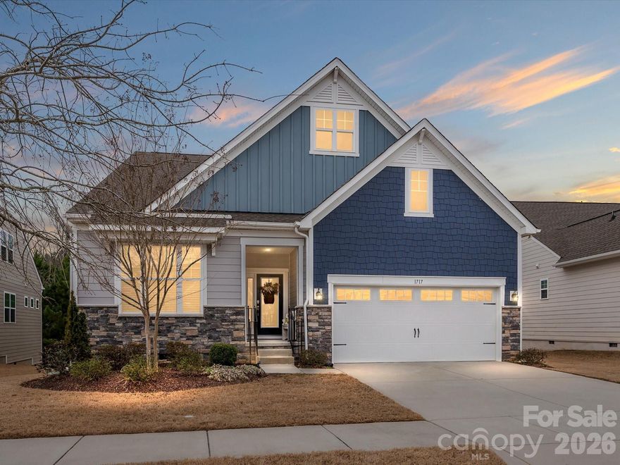 Welcome to comfort and effortless living in the gated Tree Tops 55+ community.

This gorgeous Dorchester floorplan offers the ease of true ranch-style living with the added flexibility of a second floor to accommodate any need. The smart split-bedroom layout features two guest bedrooms and a full bath at the front of the home, while the private primary suite is tucked at the back for maximum privacy. A dedicated office with French doors provides the perfect space for work or hobbies.

The gourmet kitchen is the heart of the home, showcasing a large island, double ovens, and abundant storage. It flows seamlessly into the eat-in dining area and spacious living room, creating an ideal setup for entertaining. The oversized primary suite includes private access to the screened room, while the serene bath features an oversized shower, double vanities, and a huge custom owner’s closet. All closets throughout the home have been custom designed for optimal organization.

Upstairs, you will find a versatile loft, an additional bedroom, and a full bath — perfect for guests or extended living space.

Situated on a private lot backing to wooded common area, the home offers peaceful views and outdoor entertainment, highlighted by Trex decking that extends the width of the home.

Tree Tops delivers a true resort lifestyle with a clubhouse, pools, fitness center, pickleball and tennis courts, dog park, scenic lake, walking trails, amphitheater, and The Village Cabins for arts, crafts, and social gatherings.