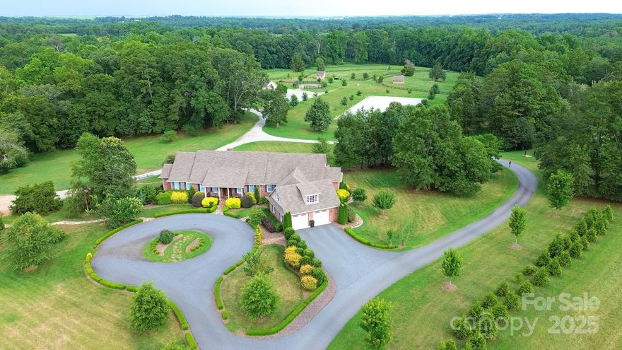 Exceptional Luxury Home on almost 33-Acres Turn-Key Equestrian Estate – No Restrictions! Welcome to this stunning custom estate where luxury meets equestrian excellence. The beautifully appointed main residence features a gourmet kitchen with Thermador appliances, spacious living areas, and separate second living quarters with a private entrance-perfect for guests, or a caretaker. Immaculate landscaping creates a private, resort-like setting. Enjoy panoramic views of the 100x200 professional riding arena from the kitchen, living room, and expansive deck—ideal for training sessions or soaking in the serene surroundings. Equestrian amenities include a 7-stall barn with oversized 14x14 matted stalls, tack room, bathroom, laundry, shaving shed, and fenced pastures for excellent turnout. The premium GGT footing in the arena supports top-tier training. A large equipment garage provides ample storage. A rare opportunity blending upscale living with elite equestrian facilities.