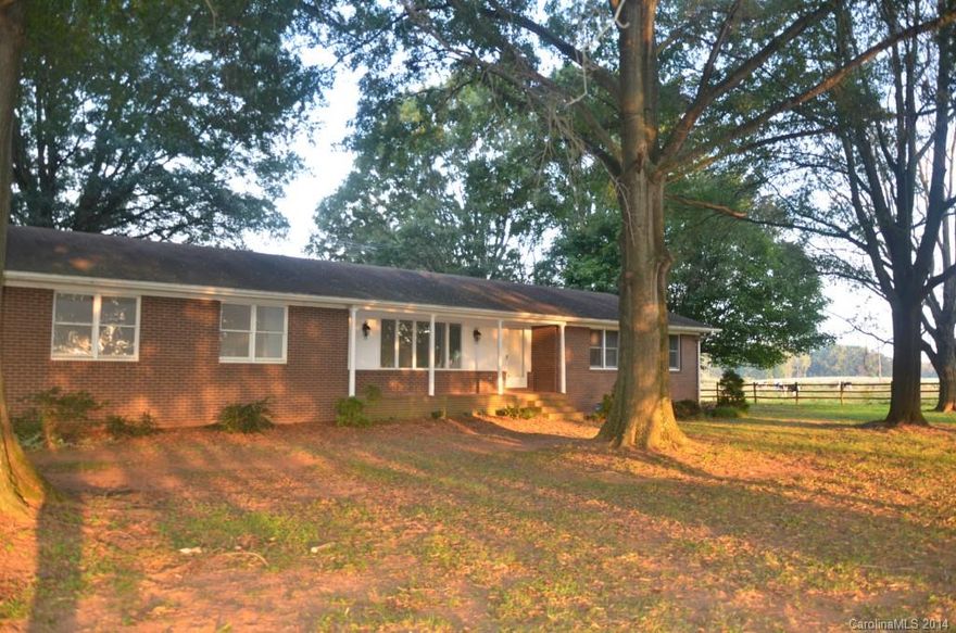 Country living at its best. Privacy and beautiful oak trees surround this home. Freshly painted. New countertops and sinks in hall bath. Remodeled master bath. Nice walk in closet in master bedroom. Full basement with no overhead duct work and ready to be finished. 2 car garage and a 1166 sq ft detached building ready for a workshop or additional car storage. This home is in a great location.