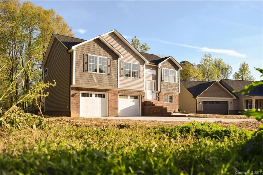 LRT Properties can be depended upon for quality workmanship and materials. Stainless appliances, granite countertops, beautiful flooring, finished garage. Put these features in the intimate community of Pickwick in Kannapolis, and what more could you want in this new construction? Drive through this neighborhood and get a feel of community.
Lower level with sitting area, bedroom, and full bath provides living area for a separate suite. The garage is a big 664 sq. ft.